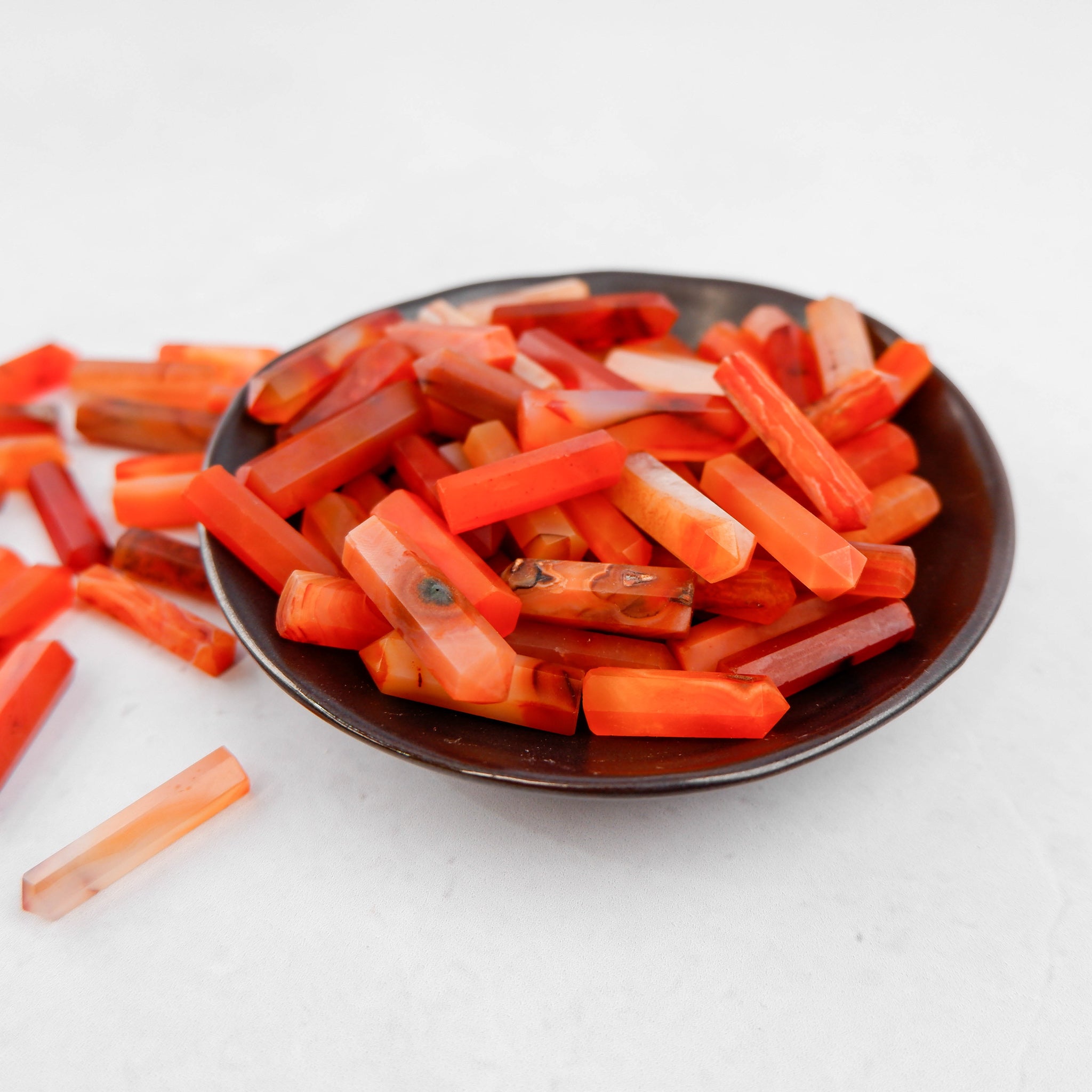 Noctis Studio Carnelian Single Gridding Point showing a polished orange-red gemstone tool for precision jewelry work.
