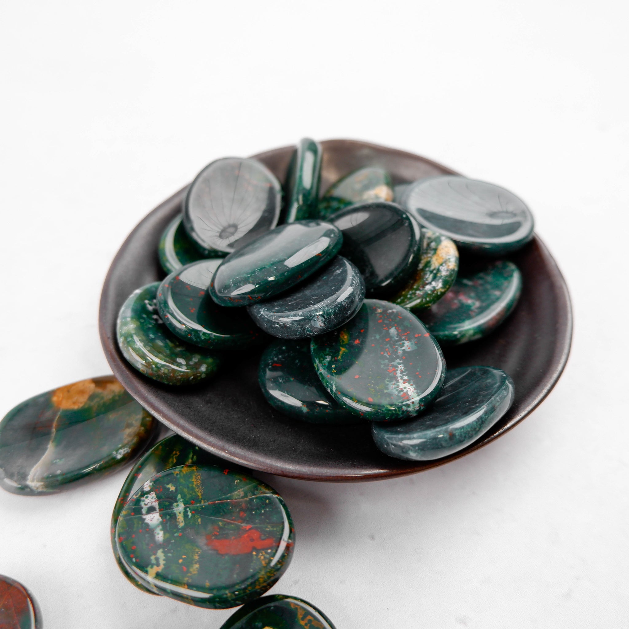 Bloodstone worry stone from Noctis Studio featuring a smooth, polished bloodstone gemstone with natural deep green and red hues.