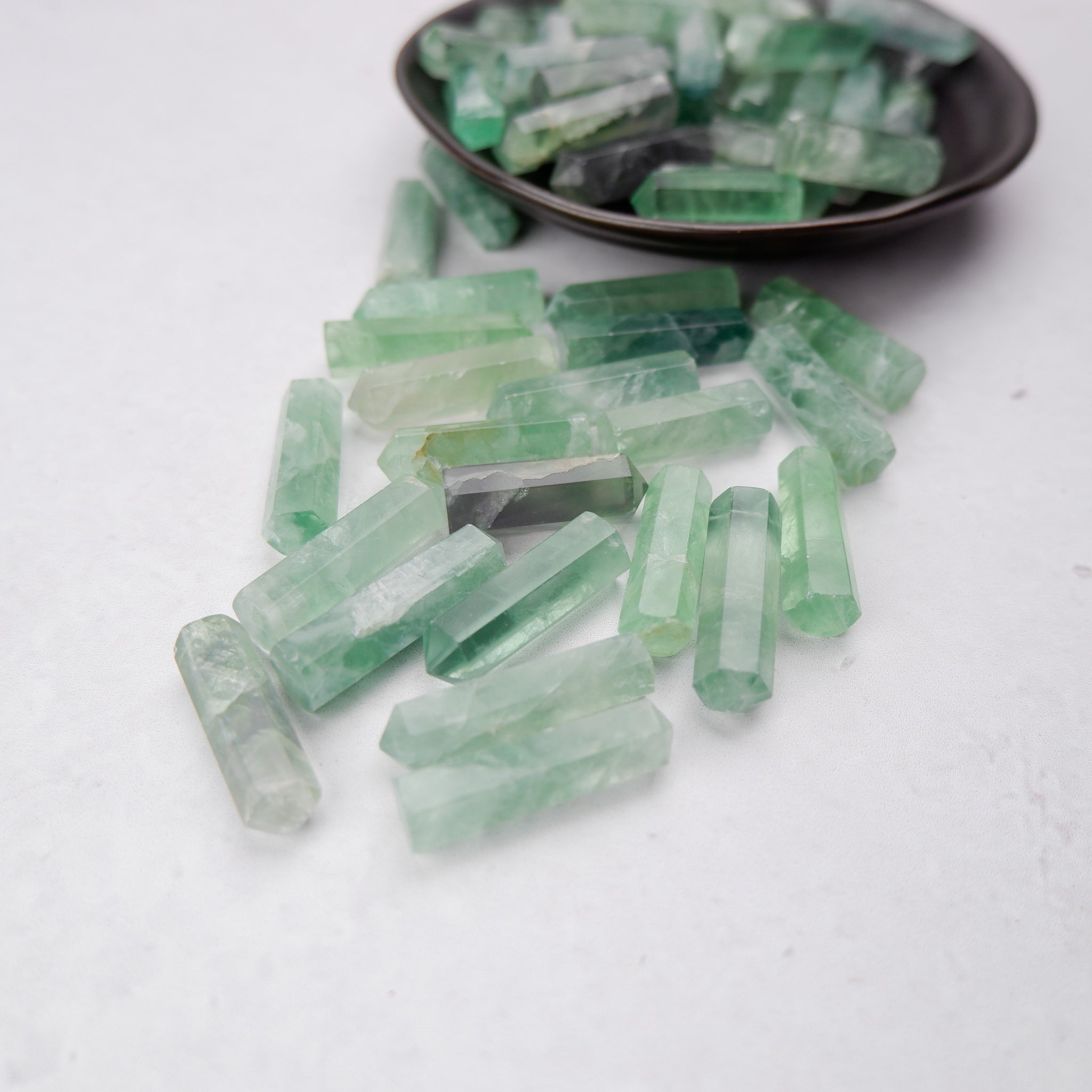 Green Fluorite Single Gridding Point from Noctis Studio, a polished mineral specimen with a pointed crystal shape for energy work.