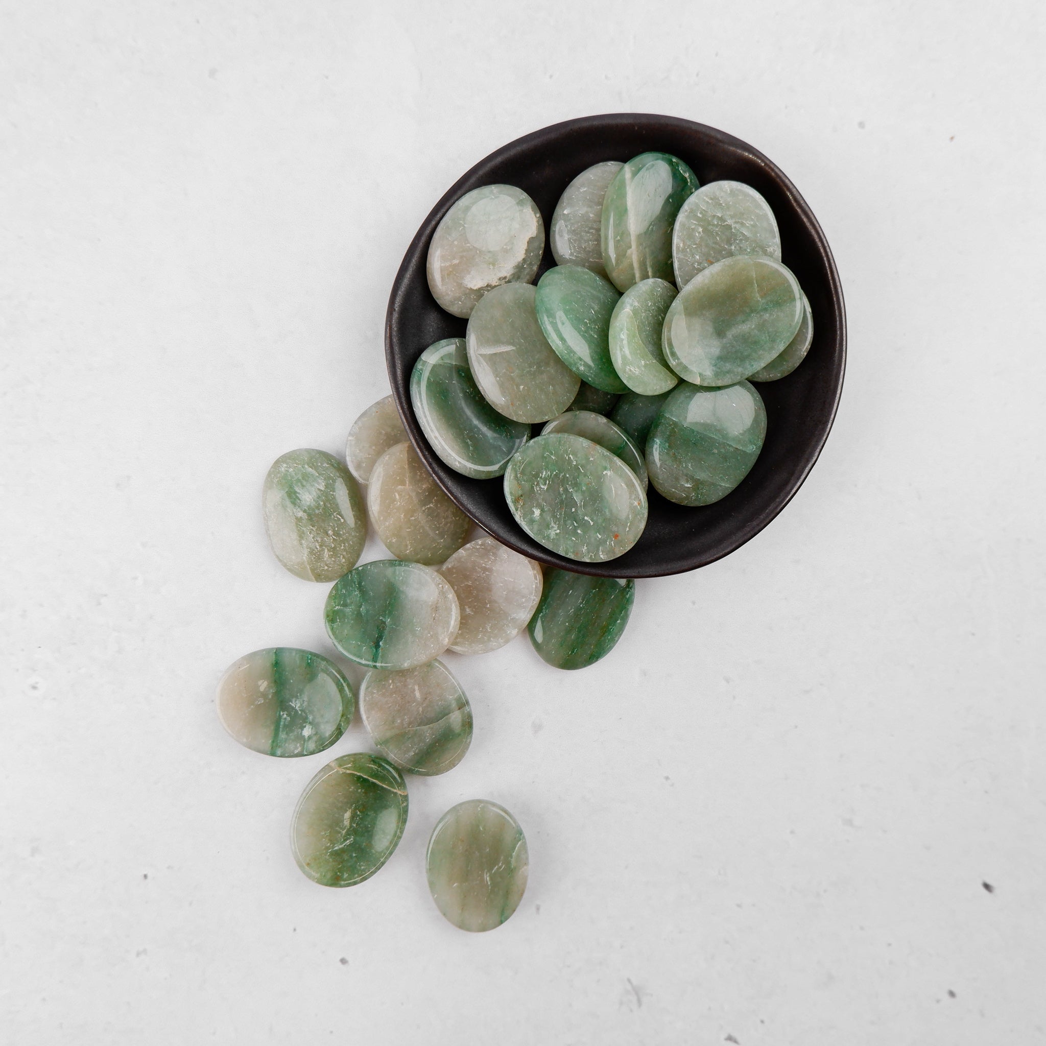 Green Aventurine worry stone from Noctis Studio, smooth polished gemstone for stress relief and calming touch.