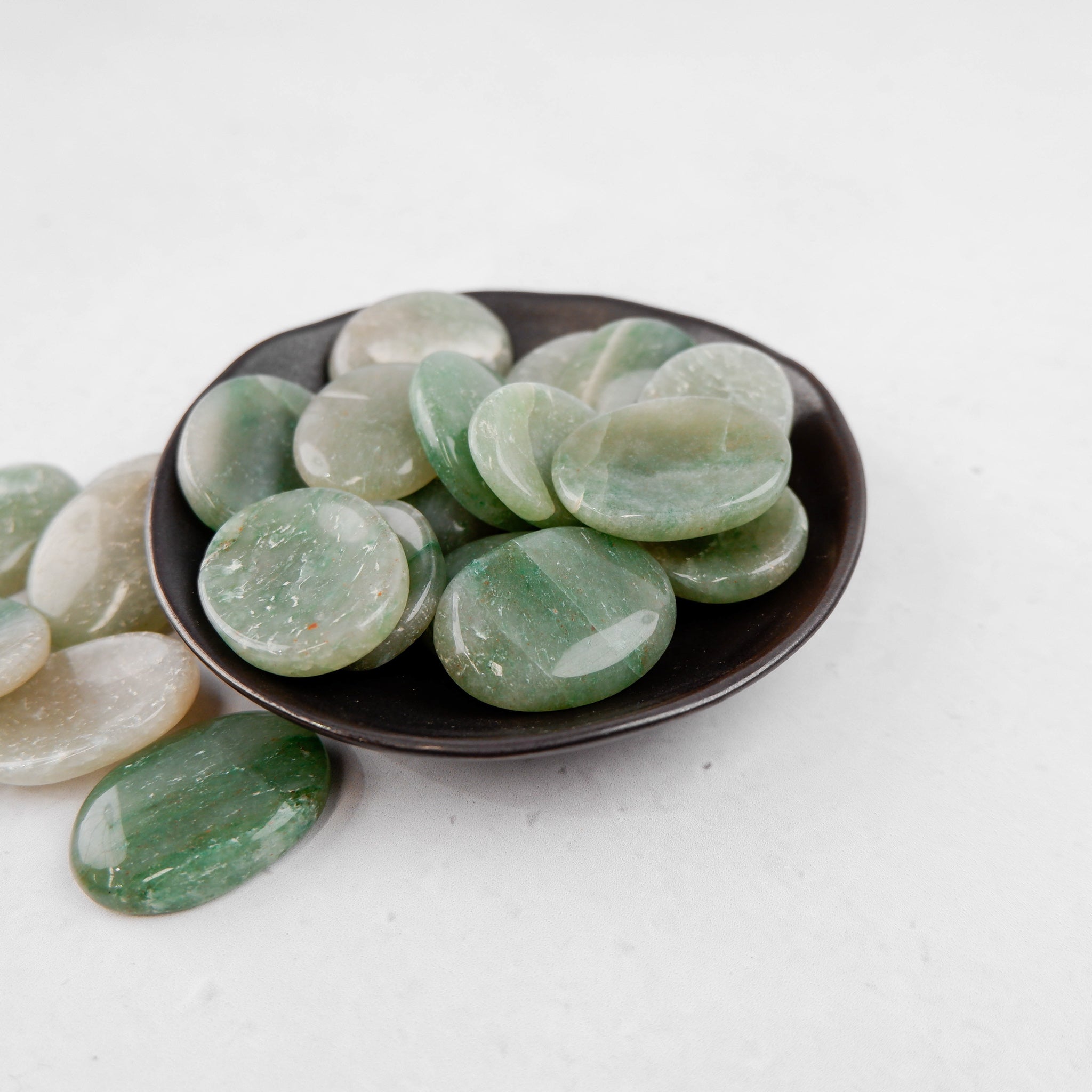Green aventurine worry stone from Noctis Studio featuring smooth, polished green gemstone with calming appearance.