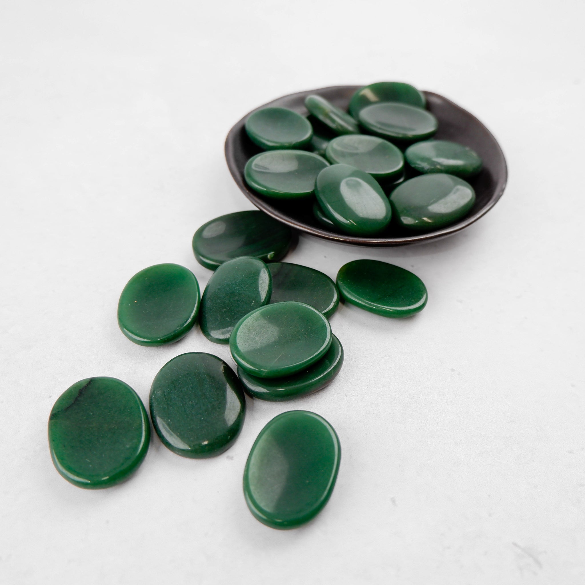 Dark green aventurine worry stone from Noctis Studio, smooth polished gemstone with rounded shape for stress relief.