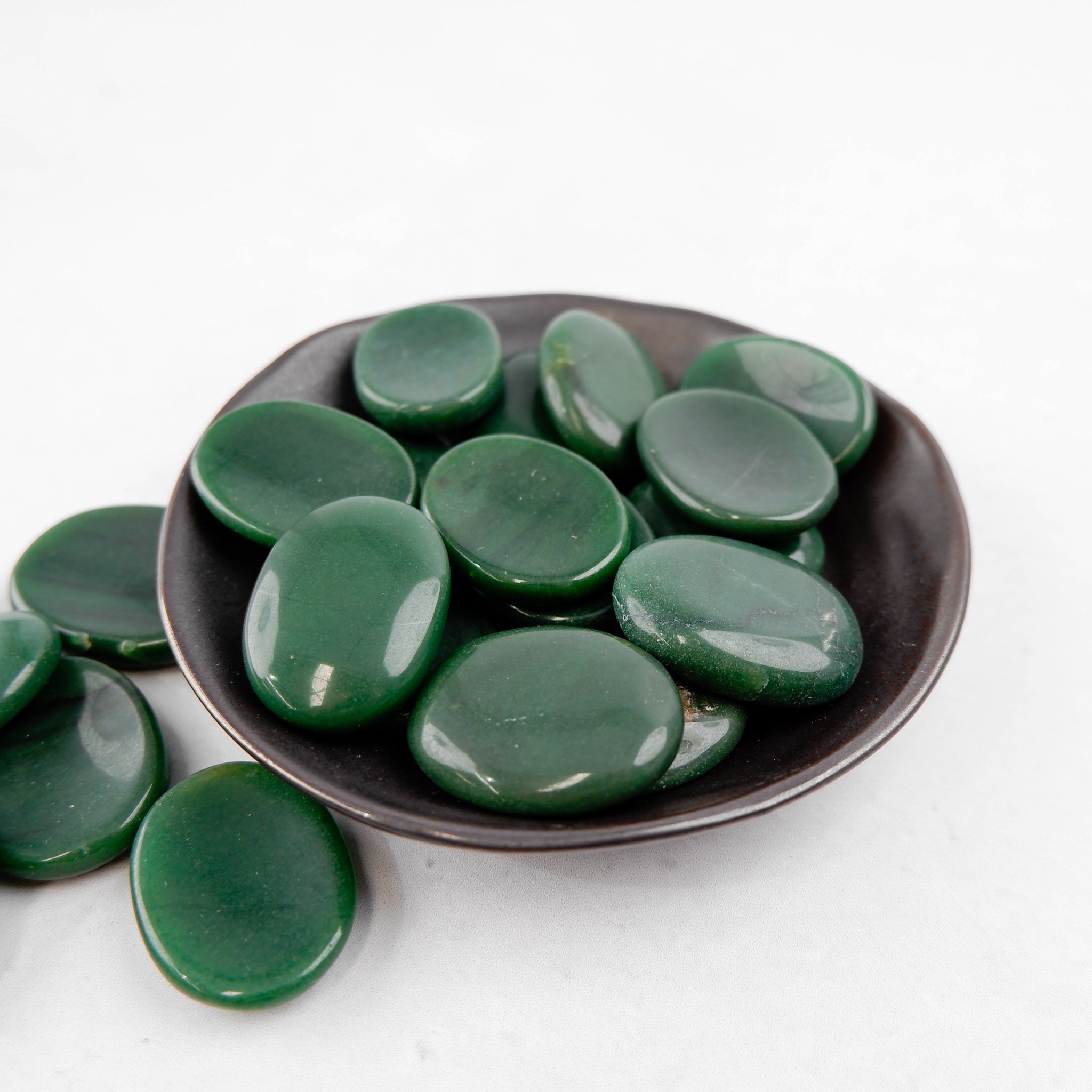 Dark green aventurine worry stone from Noctis Studio showing smooth, polished gemstone with natural green patterns and matte finish.
