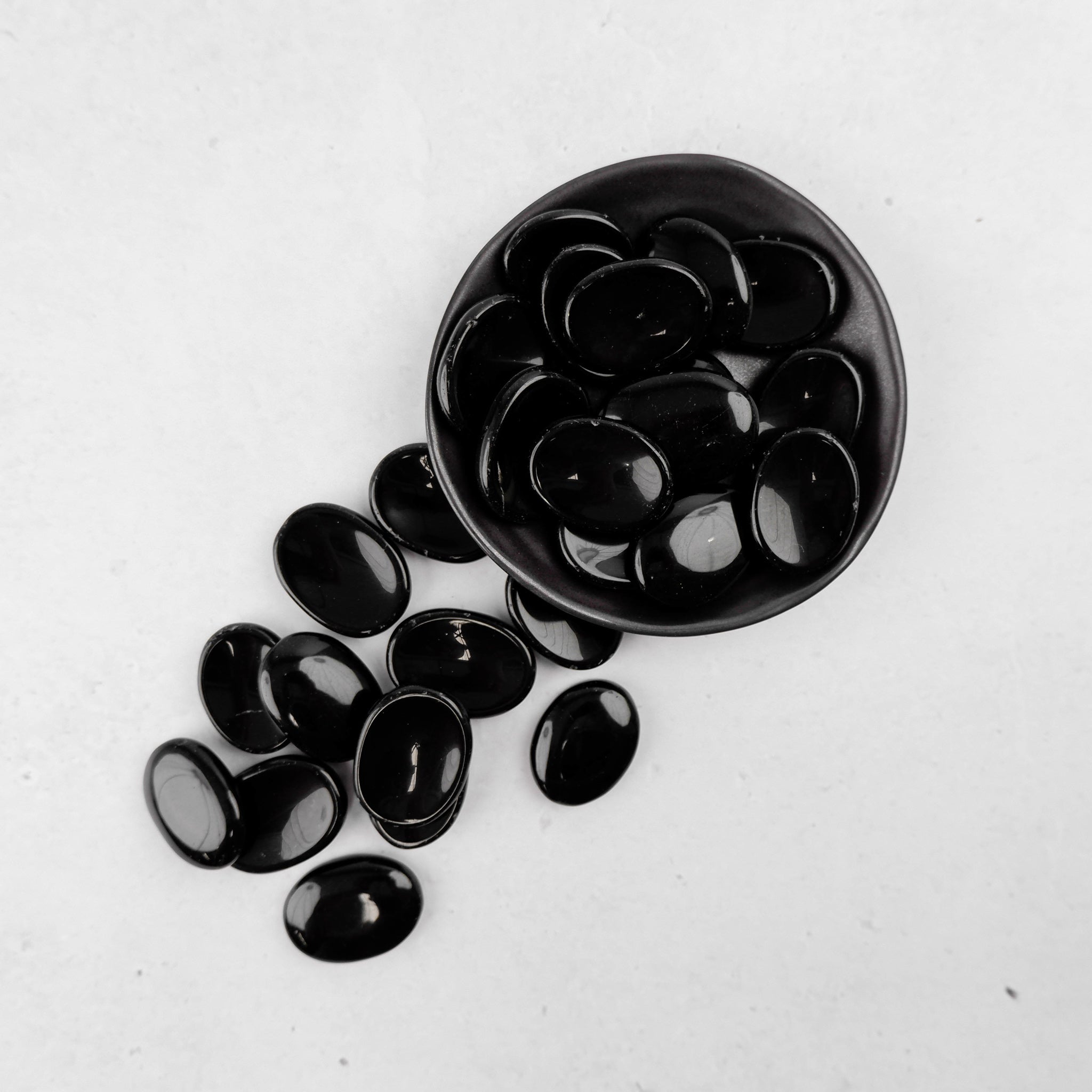 Obsidian worry stone from Noctis Studio featuring smooth black polished surface for calming stress relief.
