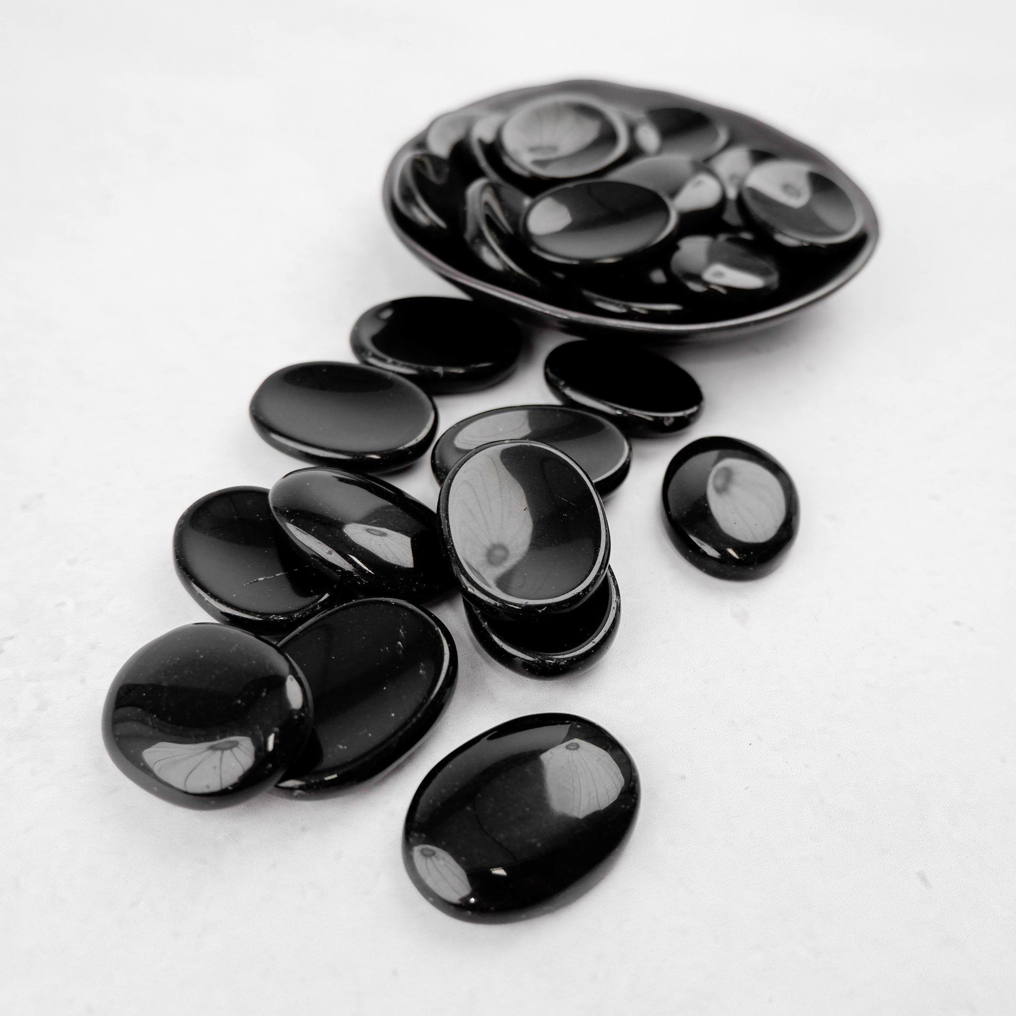 Obsidian worry stone from Noctis Studio featuring smooth, polished black gemstone for stress relief and mindfulness.