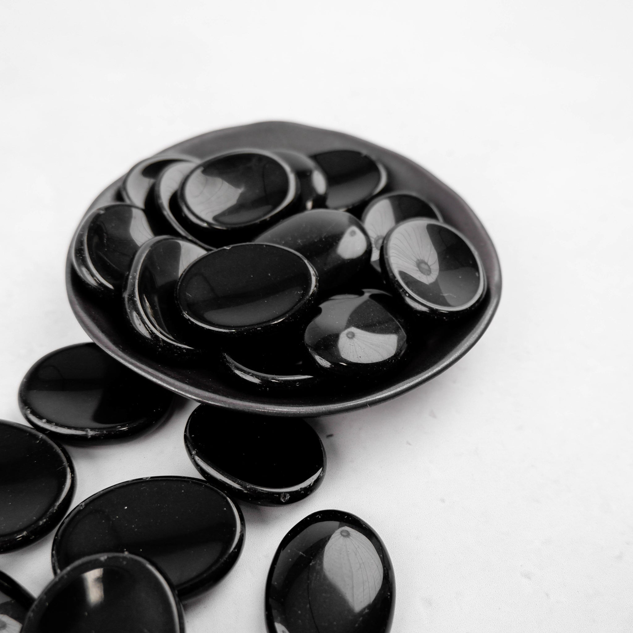 Obsidian worry stone from Noctis Studio featuring smooth, polished black stone for stress relief and meditation.