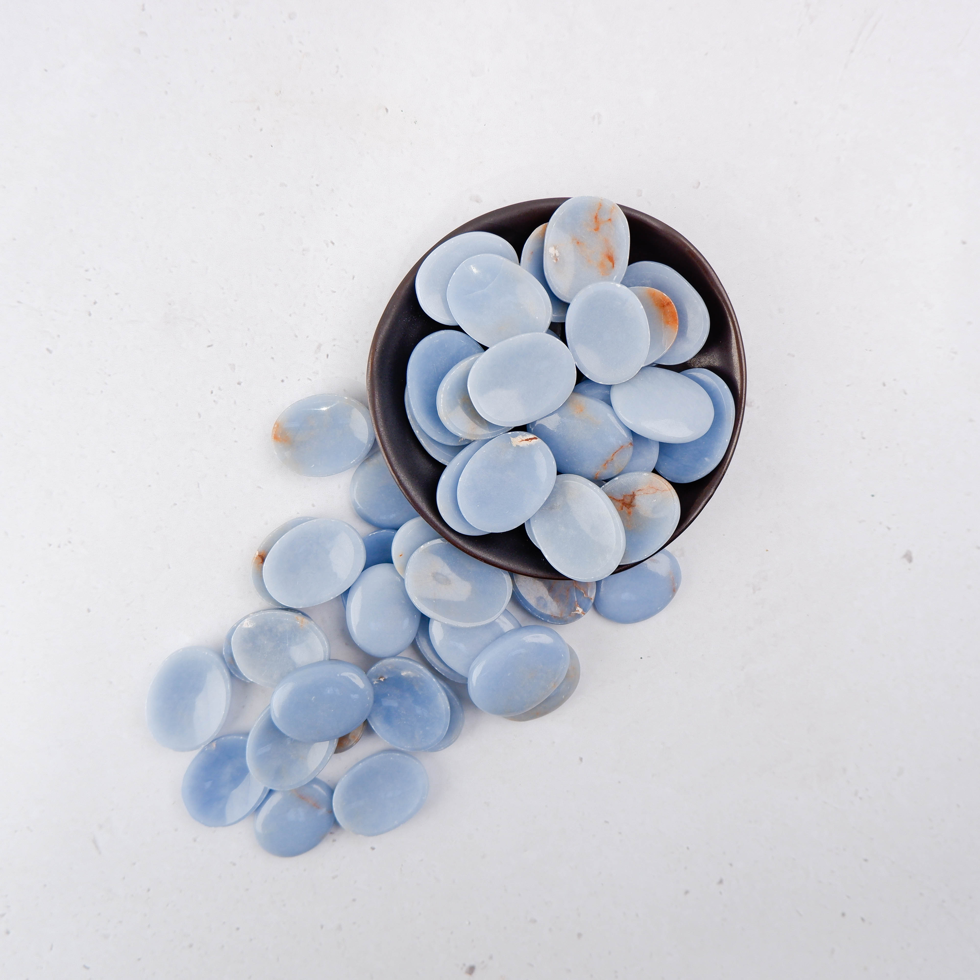 Noctis Studio Angelite worry stone with smooth, polished blue gemstone shape for calming and stress relief.