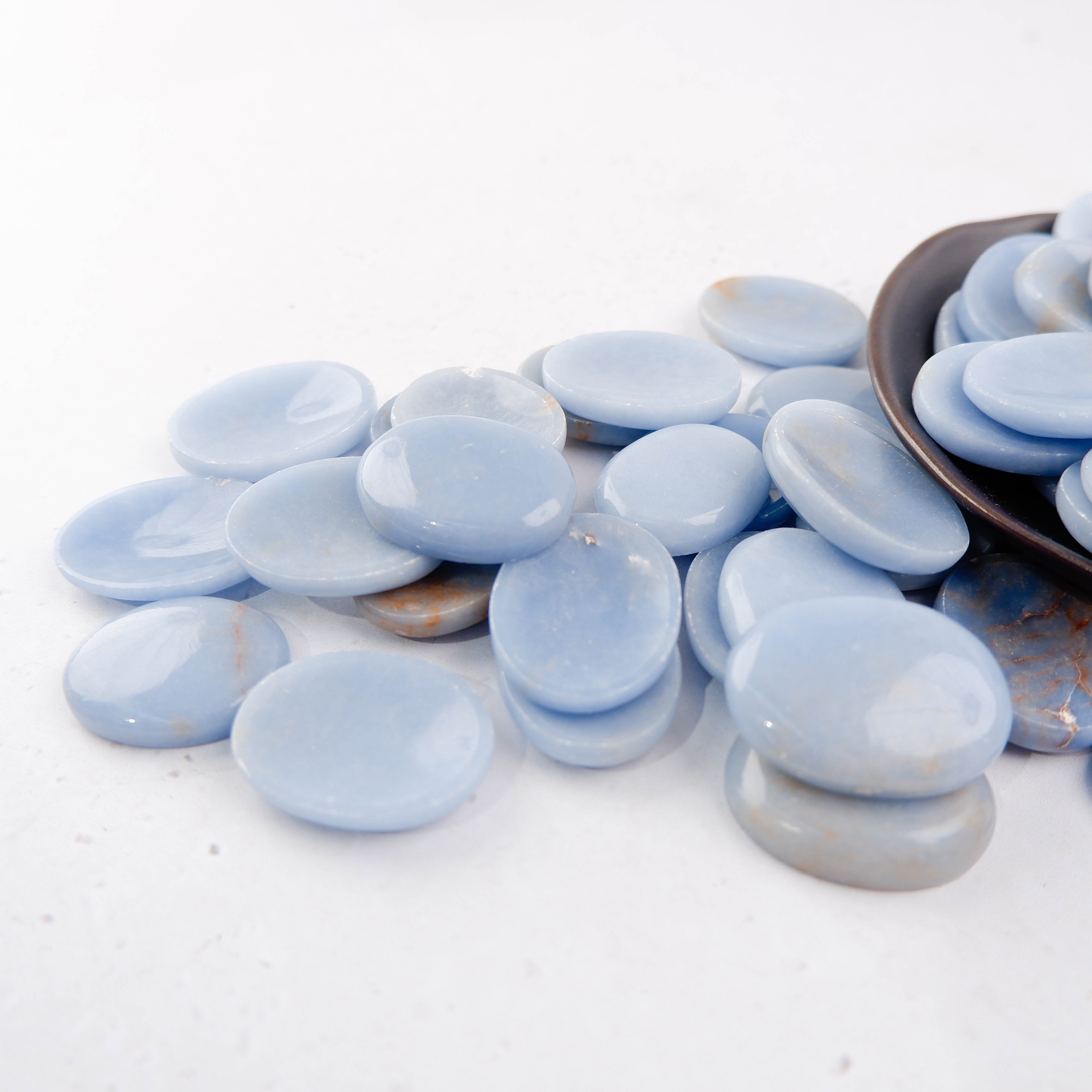 Angelite worry stone from Noctis Studio, smooth blue gemstone worry stone with polished surface and natural stone pattern.