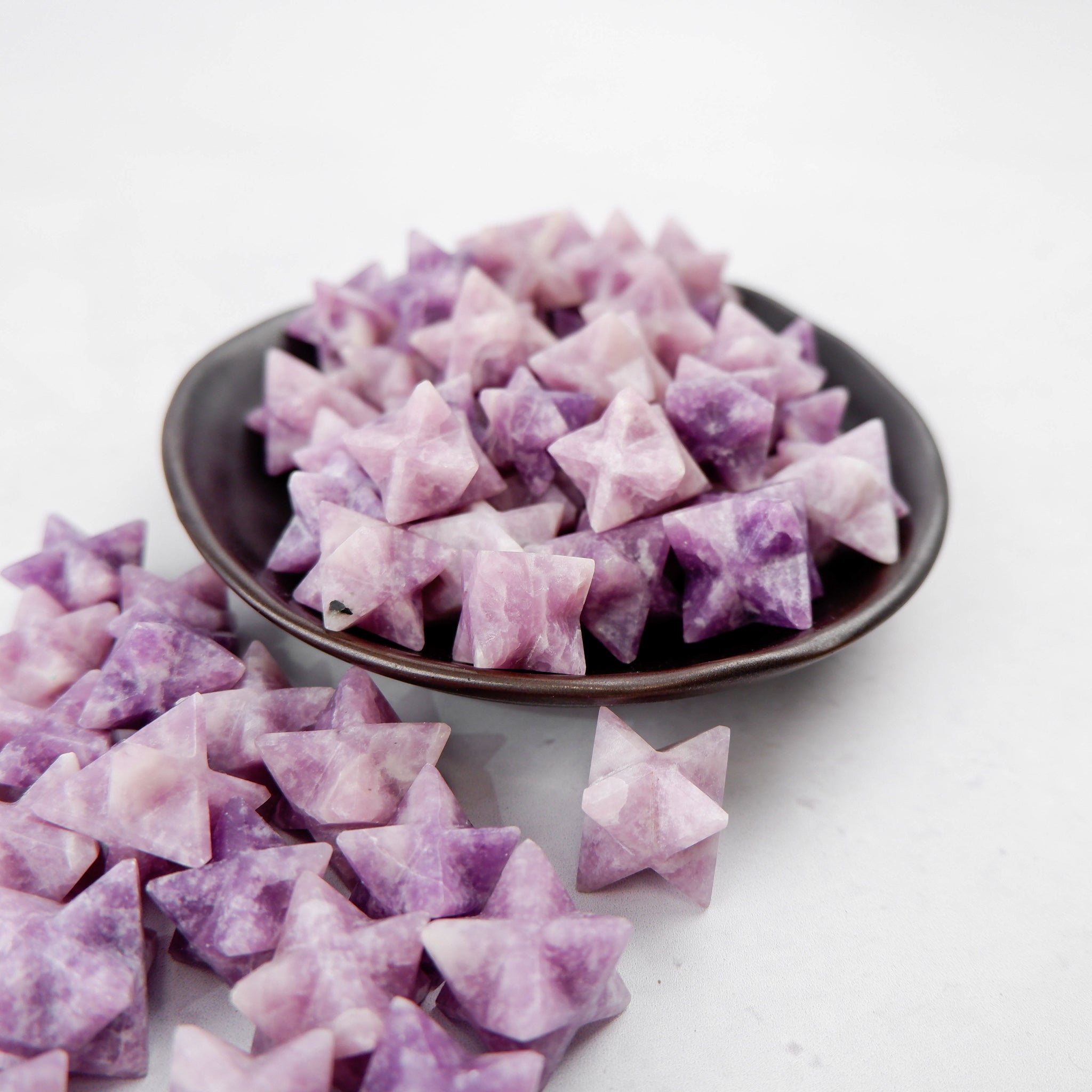 Lepidolite star from Noctis Studio, polished gemstone with purple hues and natural crystalline texture.