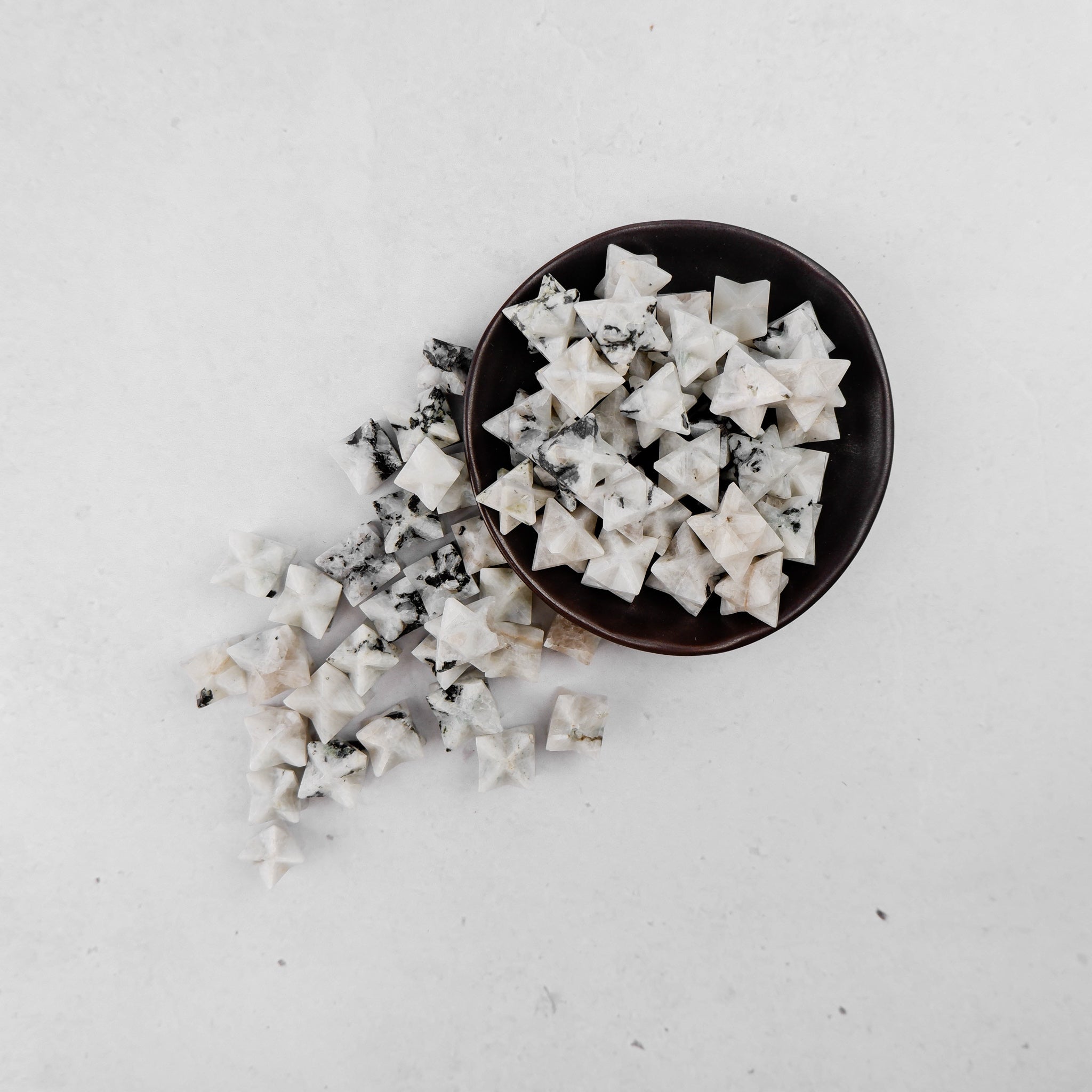 Moonstone star pendant by Noctis Studio featuring a luminous, polished moonstone gemstone shaped like a star.