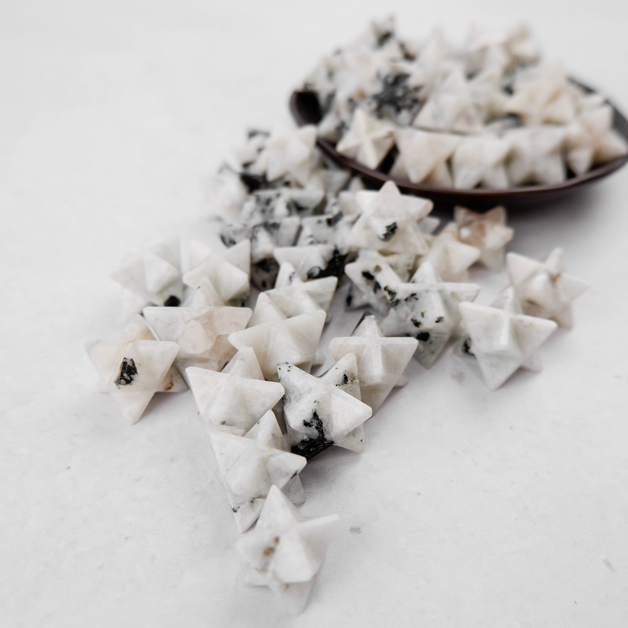 Shimmering moonstone star pendant by Noctis Studio, featuring a polished star-shaped gemstone with a luminous glow.