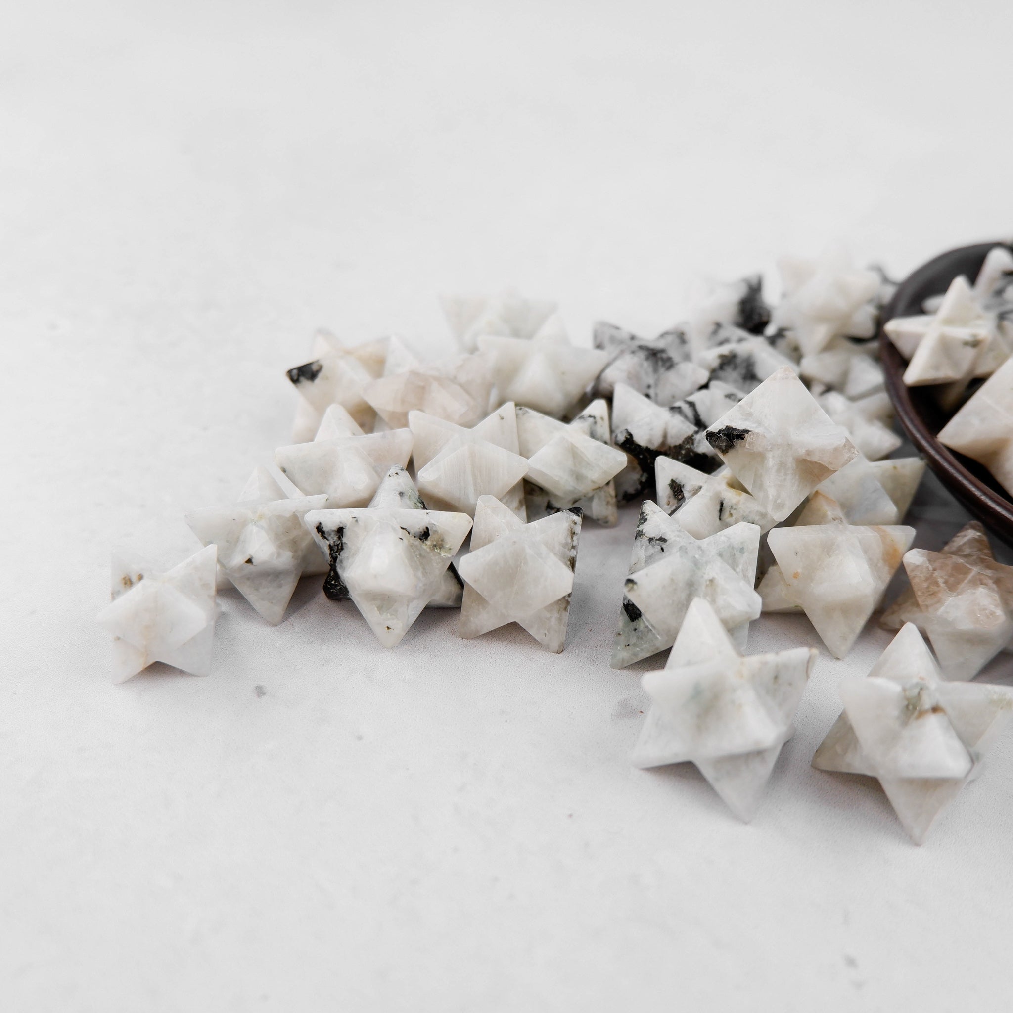 Shimmering moonstone star pendant from Noctis Studio with a polished, luminous surface and a delicate star shape.