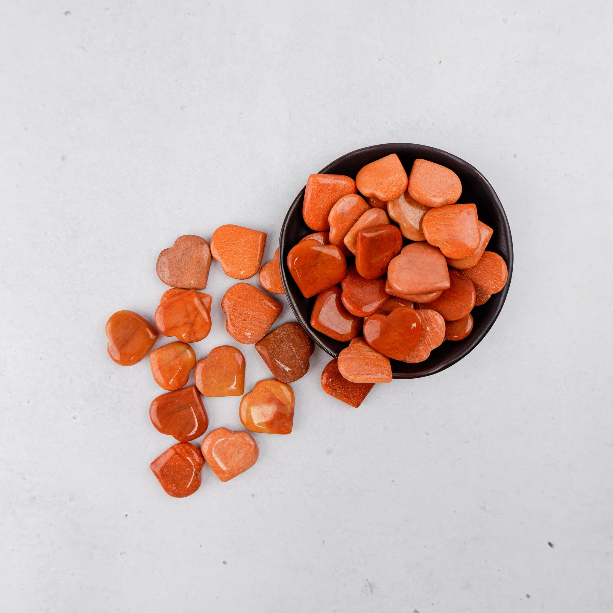 Peach aventurine heart-shaped gemstone from Noctis Studio, smooth polished stone with gentle color and natural texture.