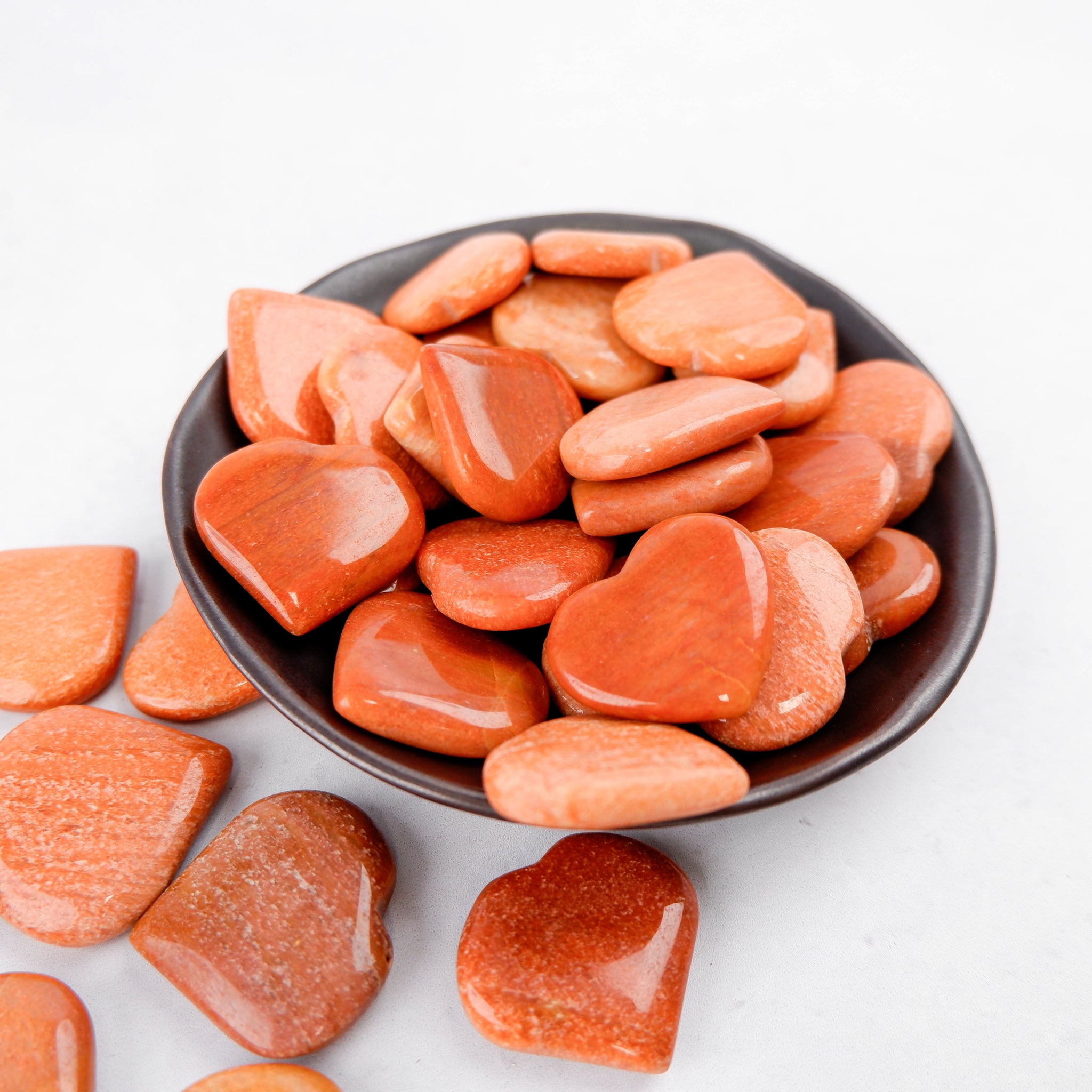 Peach aventurine heart gemstone by Noctis Studio, smooth polished stone with natural color and subtle veining.