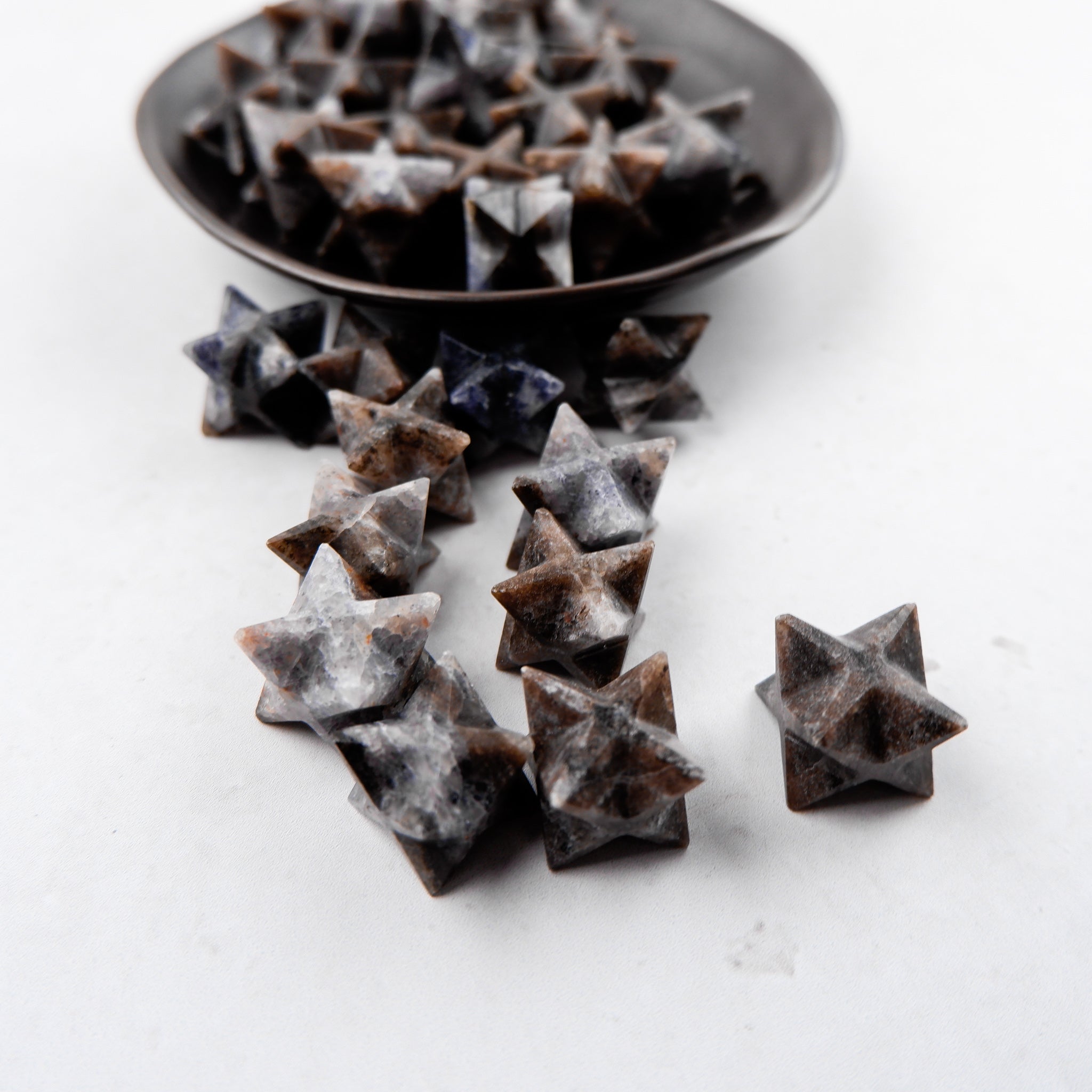 Iolite star sculpture by Noctis Studio, featuring a detailed star-shaped design with vibrant blue and violet hues.