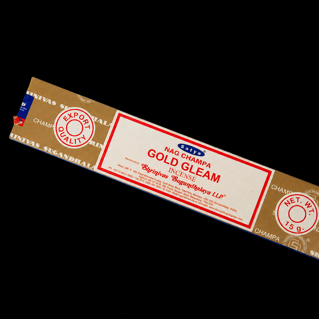 Golden gleam Satya Incense sticks from Noctis Studio, displayed in a box with a few sticks visible and a warm, inviting background.