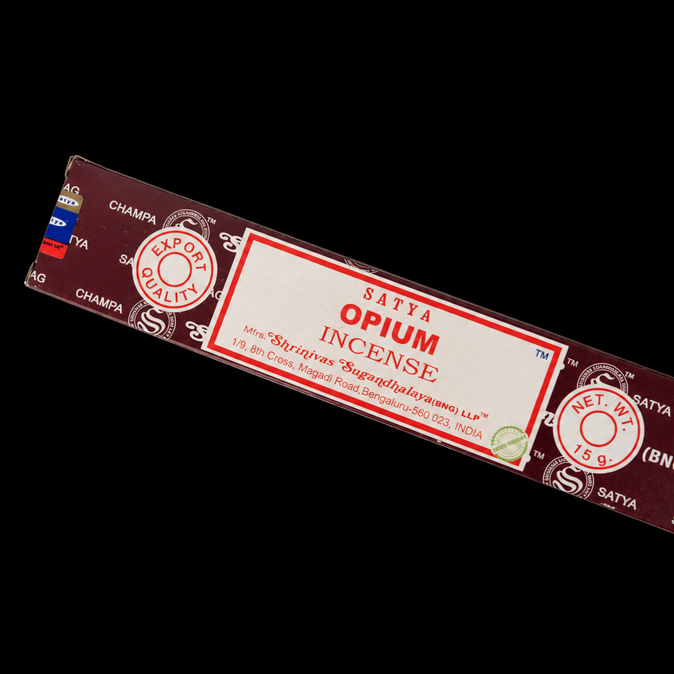 Scented Opium Satya incense sticks from Noctis Studio, arranged in a box with aromatic incense cones and packaging details.