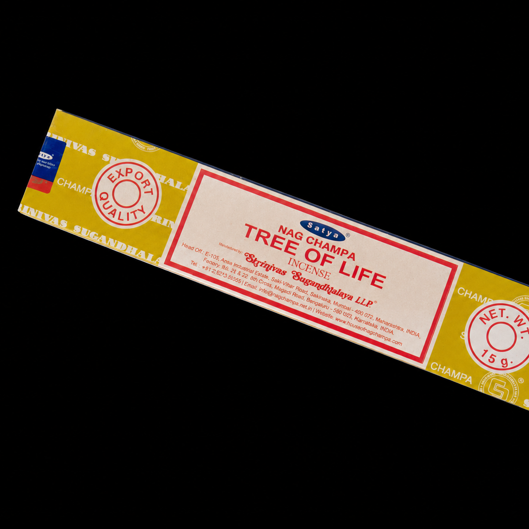 Scented incense sticks labeled Tree of Life Satya Incense by Noctis Studio, shown in a decorative box with floral design.