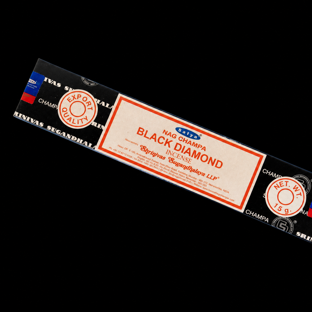 Black Diamond Satya incense sticks from Noctis Studio, shown in a decorative container with incense sticks ready for use.