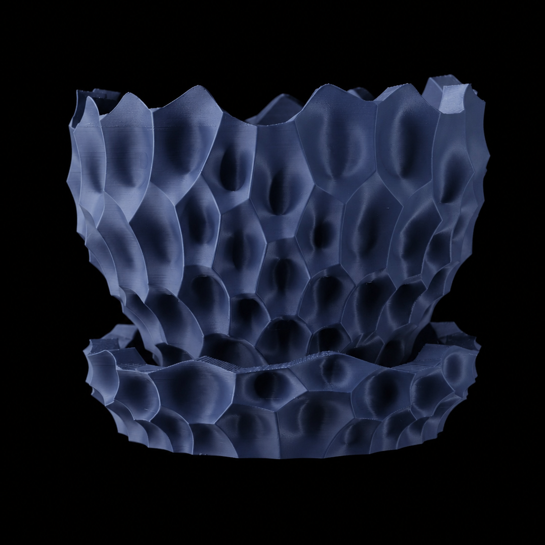 Modern Machine Thorn Planter with sleek, minimalist design and textured surface, suitable for indoor or outdoor plants.
