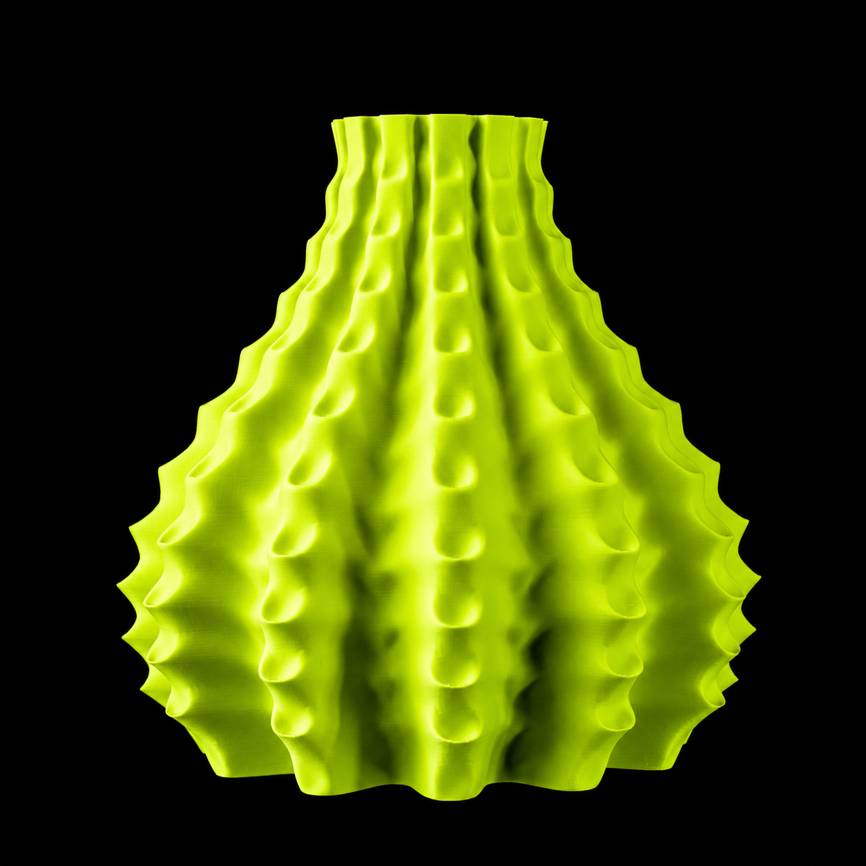 Modern Machine Rippleform Vase with a textured ripple design in ceramic, showcasing its elegant, curved shape and glossy finish.