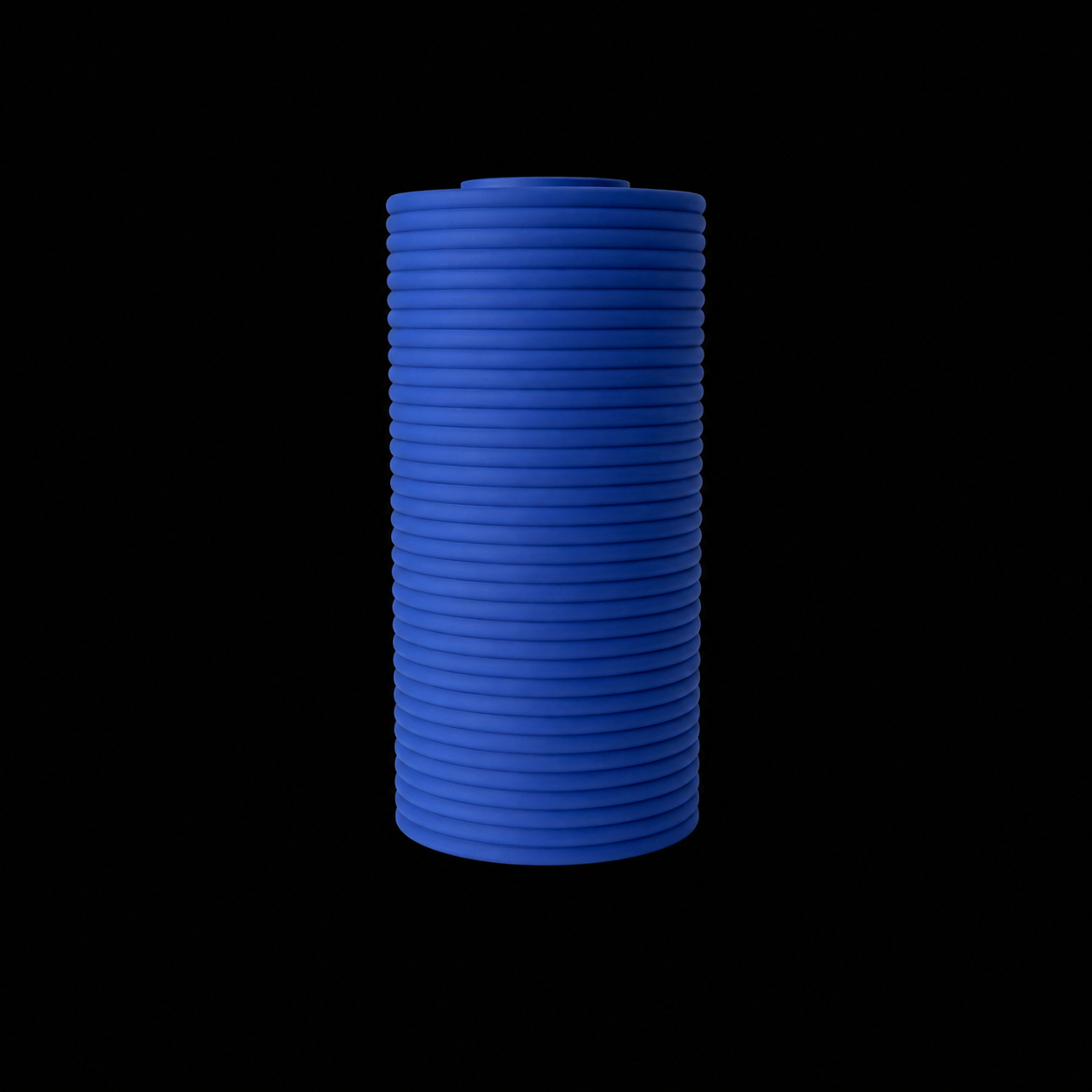 Modern Machine column vase with a sleek, minimalist design, showcasing a tall, cylindrical glass vessel for floral arrangements.