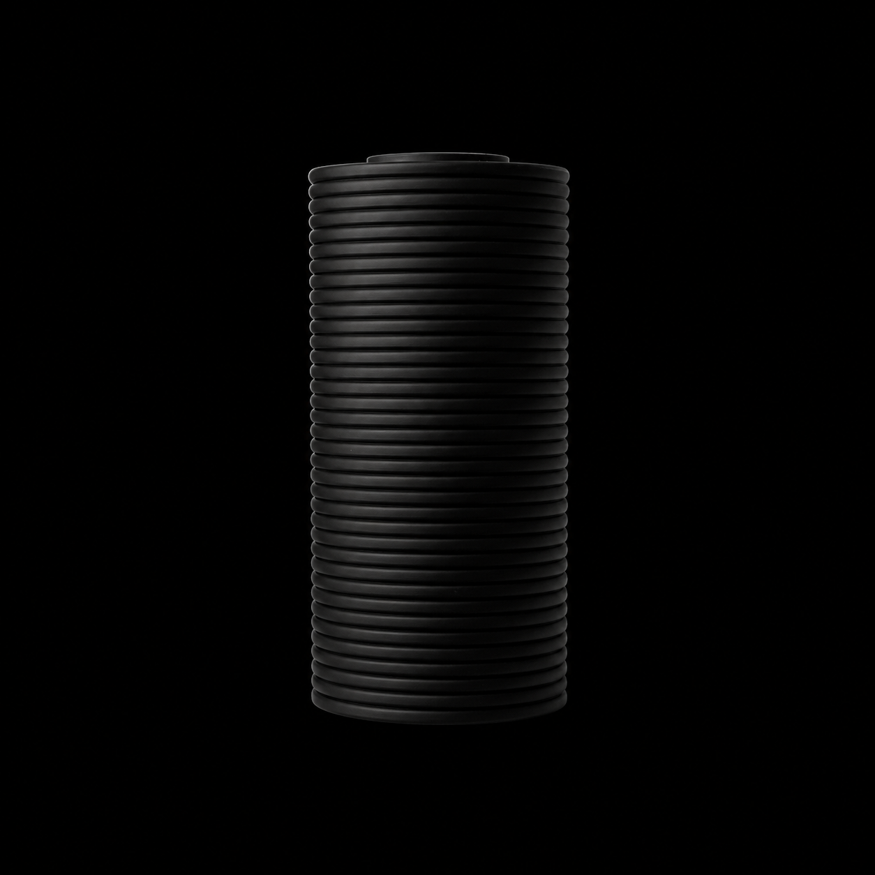 Modern Machine column vase with sleek, tall design suitable for modern home decor, shown in a neutral color.