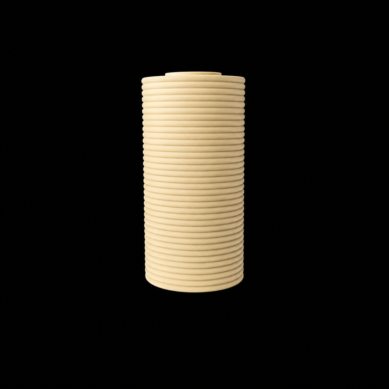 Modern Machine column vase with a sleek, tall design in a neutral finish, perfect for contemporary floral displays.