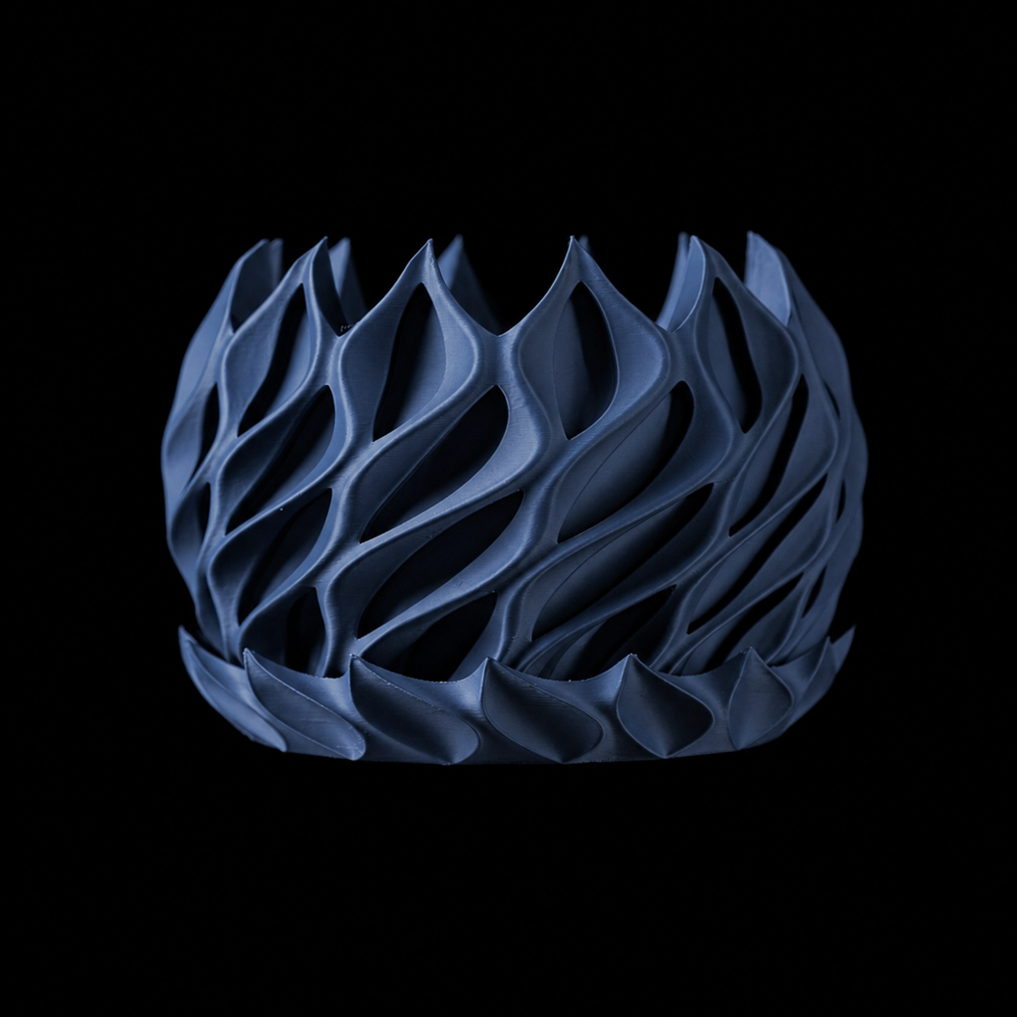 Modern Machine Helix Planter with twisted ceramic design for stylish indoor or outdoor plant display.
