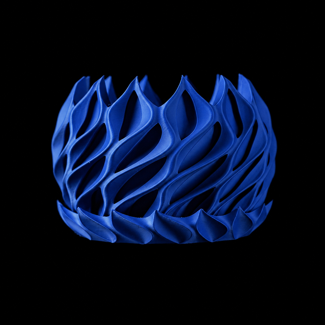 Modern Machine Helix Planter with twisted, spiral design for indoor or outdoor plant display.